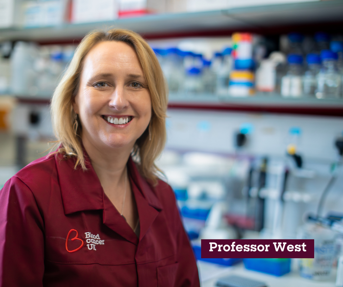 Headshot of professor Michelle West, in the lab smiling wearing a Blood Cancer UK lab coat.