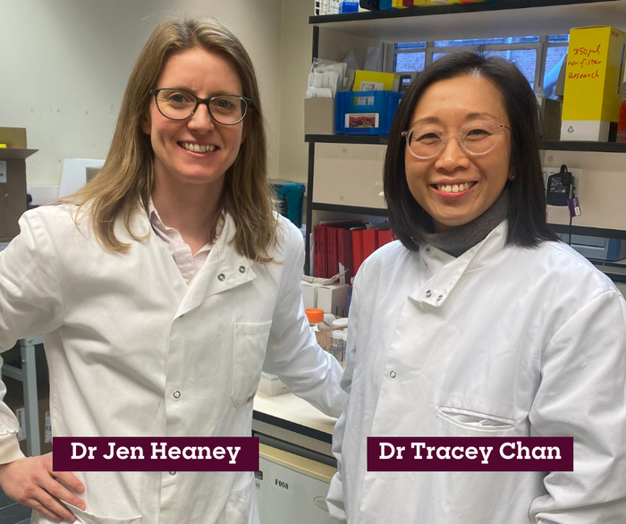 Dr Tracey Chan and research team member Dr Jen Heaney stood in the lab smiling.