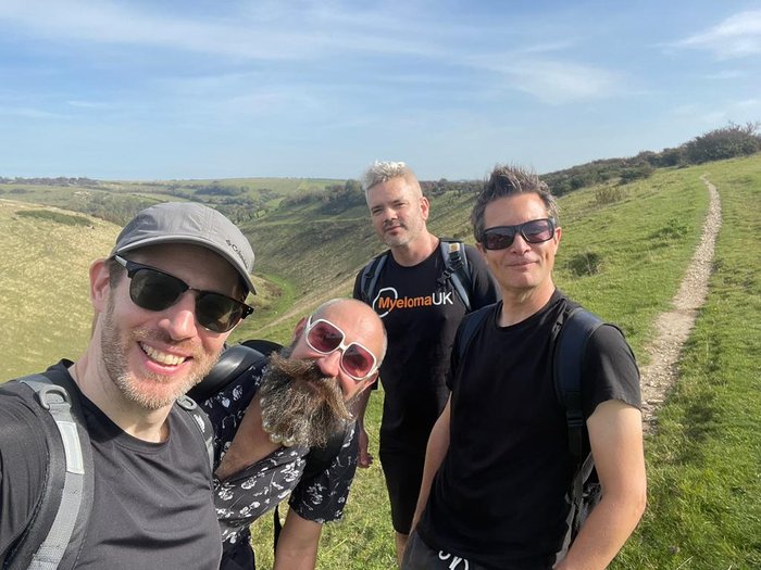 David, enjoying a long walk with a group of friends.