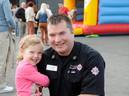 Ally and his young daughter. Ally is wearing fire brigade uniform