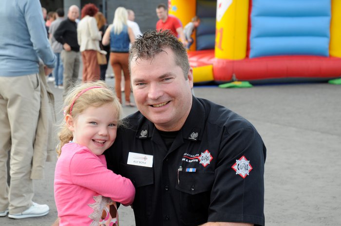 Ally and his young daughter. Ally is wearing fire brigade uniform