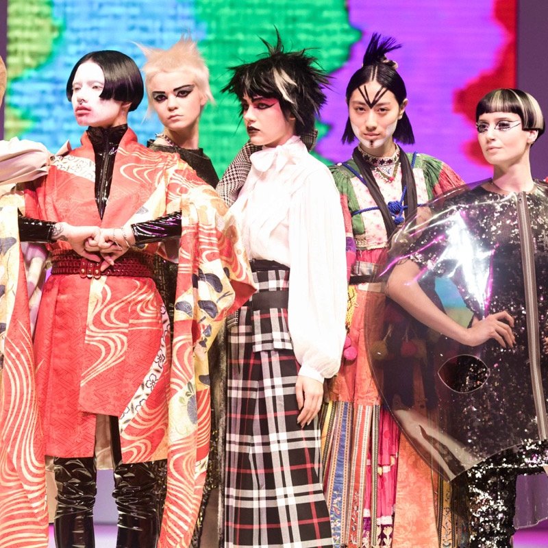 Participants on stage in costume at the 'Alternative Hair Show'