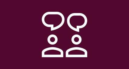 A Blood Cancer UK branded icon in white and maroon of two people with speech bubbles above their head, as if in conversation with one another.