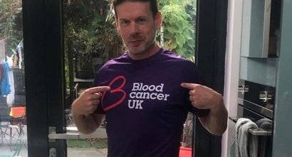 Ed, who is living with ET, wearing a Blood Cancer UK to go on a training run