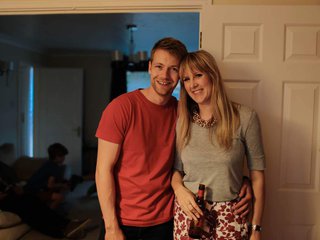 Emma, who was diagnosed with acute lymphoblastic leukaemia in 2015 stood in her home with her partner, drinking a bottle of beer.