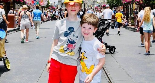 Hugo, who was diagnosed with acute lymphoblastic leukaemia (ALL), at Disney World, stood in front of the palace at Magic Kingdom.