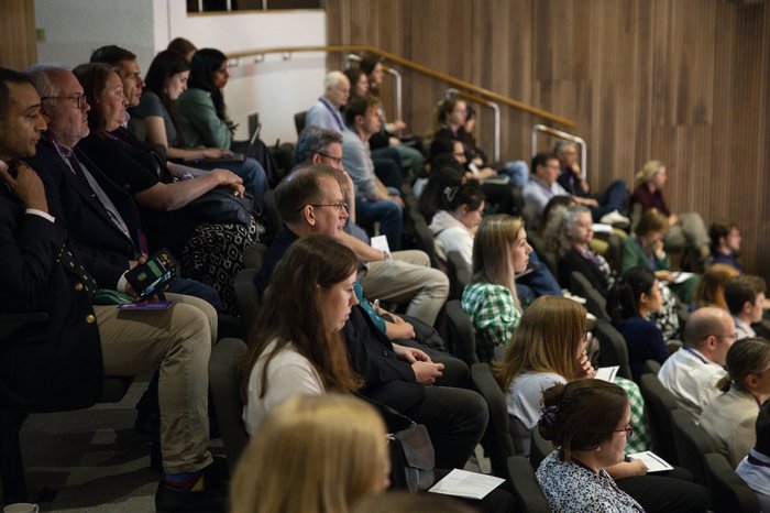 People sit in a conference hal