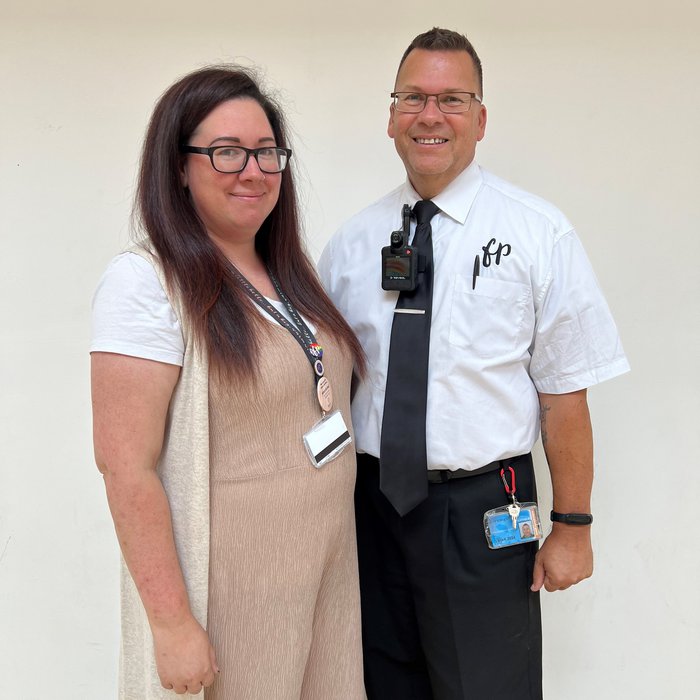 Mart and Kayleigh dressed for work with their lanyards on