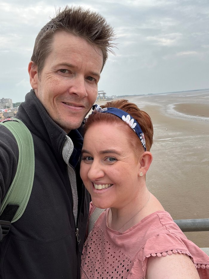 Kerry, who is living with myeloma, with her husband at the seaside