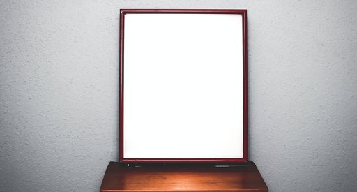 Image of a mirror standing on a dressing table.