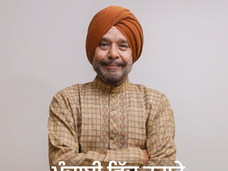 An image of the front cover of our Polish flyer. On the front cover, there is a photo of a man in traditional Punjabi clothing, looking into the camera with a gentle smile. Below him are some Punjabi words, which mean "Support for you in Punjabi"