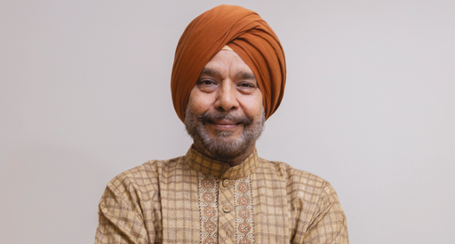 An image of the front cover of our Polish flyer. On the front cover, there is a photo of a man in traditional Punjabi clothing, looking into the camera with a gentle smile. Below him are some Punjabi words, which mean "Support for you in Punjabi"