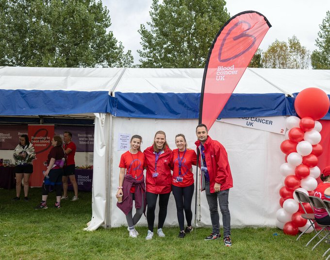 Group of volunteers infront of white tent at the Great North Run