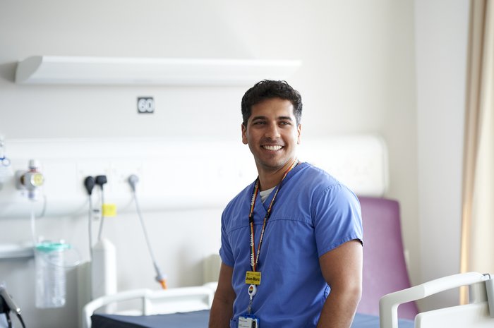 An image of a nurse in uniform working at a hospital.