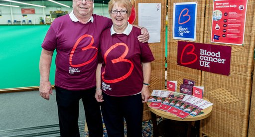 Two people at a quiz event, smiling