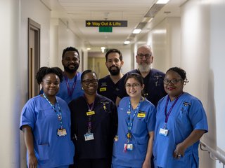 A group of healthcare professionals in uniform at a hospital