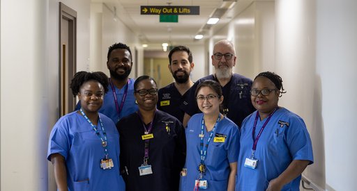 A group of healthcare professionals in uniform at a hospital