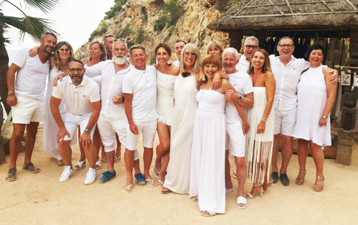 Sara, who was diagnosed with Waldenström macroglobulinaemia (WM), with friends and family in Ibiza all wearing white outfits to celebrate her remission.