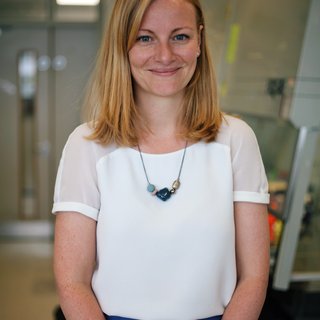 Dr Sarah Dimeloe stood smiling.