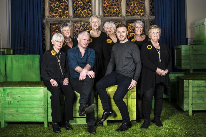 The original Calendar Girls posing next to Tim Firth and Gary Barlow for Calendar Girls The Musical.