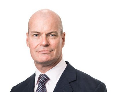 Headshot of Tim Gillbanks, Vice-Chair for Blood Cancer UK, wearing a suit and looking at the camera.