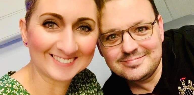 Gail and her husband David smiling and keeping their fingers crossed while waiting for test results.