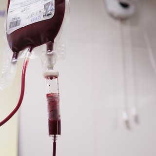 A bag of blood on a drip, ready to transfuse to someone with blood cancer.