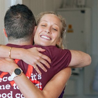 Two Blood Cancer supporters hug at the London marathon race reception