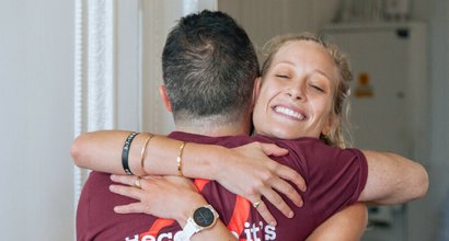 Two Blood Cancer supporters hug at the London marathon race reception