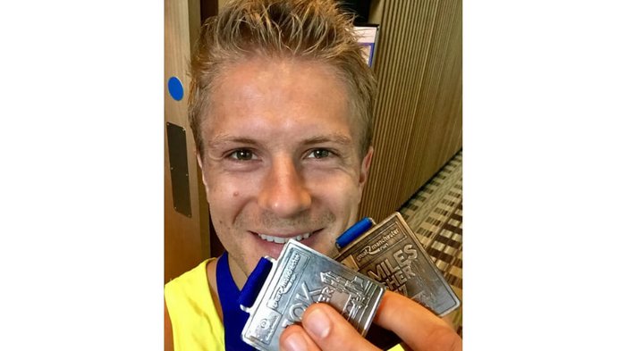 Casualty star George Rainsford with his Manchester race medals