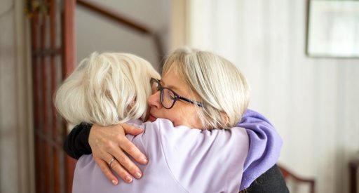 Two people embracing.