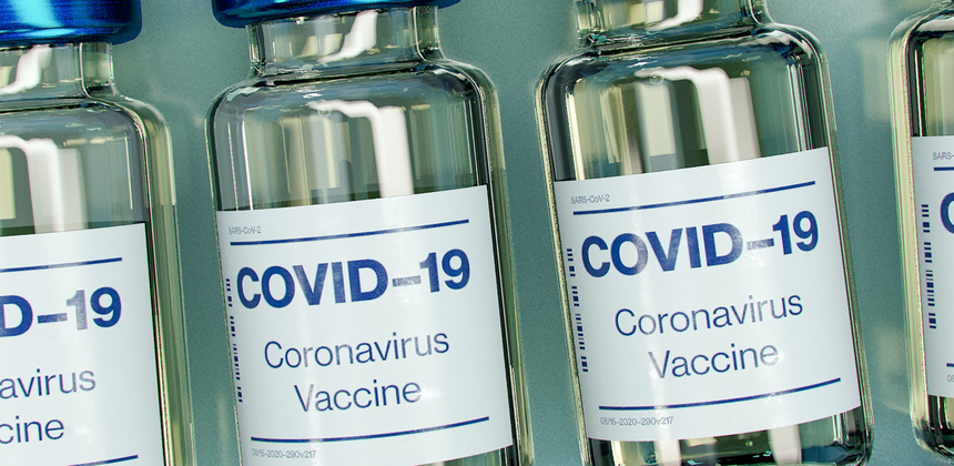 Close-up of Covid-19 vaccine vials laid out in rows.